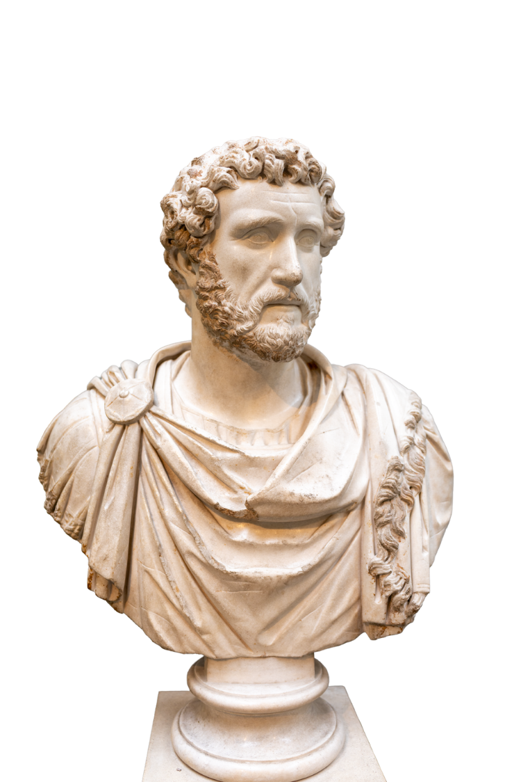 This marble bust depicts the Roman Emperor Antoninus Pius, who reigned from 138 to 161 CE.Portrait Details: The bust shows the emperor with a full, neatly trimmed beard, a feature that remained consistent throughout his 23-year reign.Military Attire: He is depicted wearing a military cloak (paludamentum) fastened with a brooch on his right shoulder.Provenance: This specific sculpture, housed in the British Museum, was found at the House of Jason Magnus in Cyrene, North Africa, and is believed to date to circa 140–160 CE.Historical Context: Antoninus Pius was the fourth of the Five Good Emperors and oversaw a period of relative peace and prosperity known as the Pax Romana.